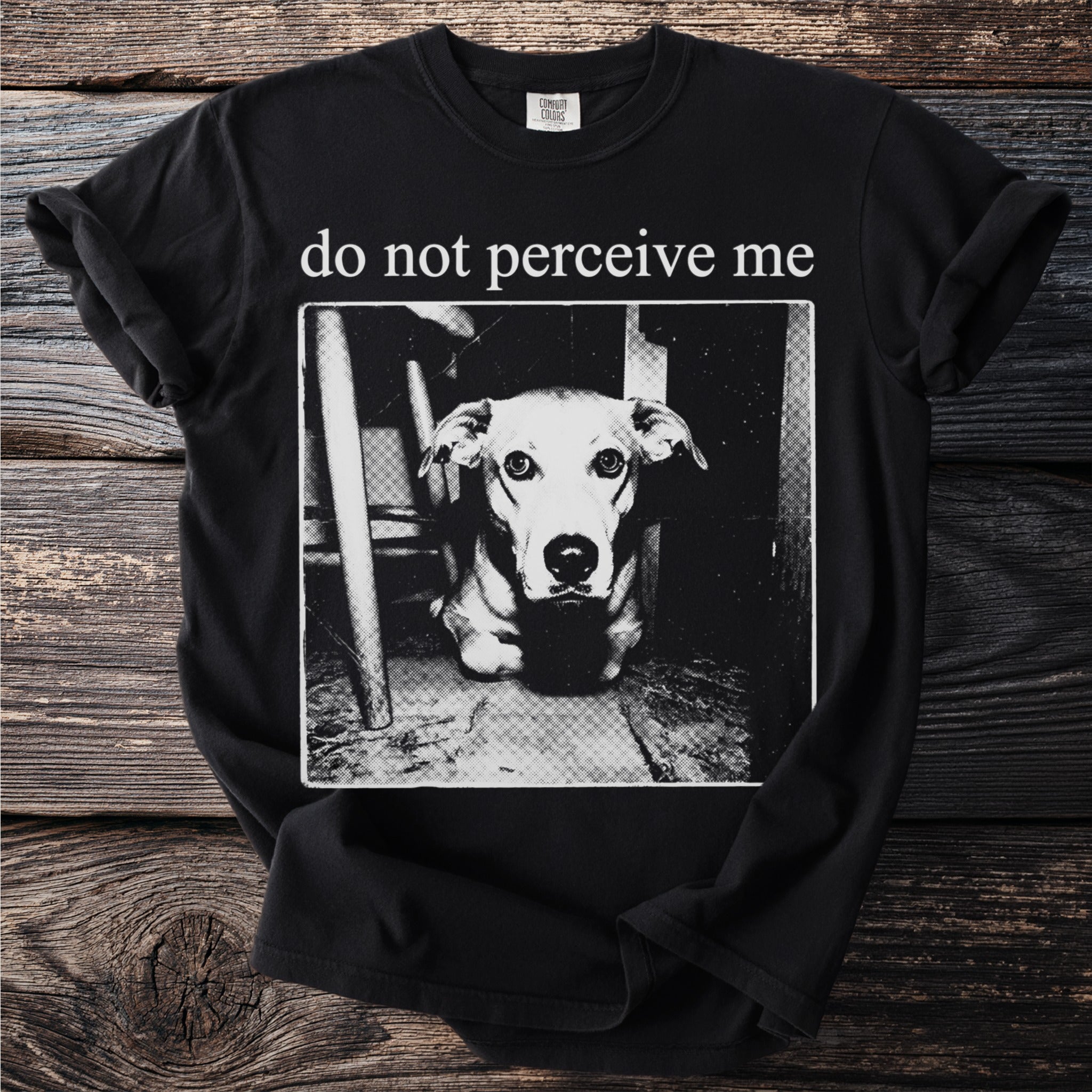 Black t-shirt with a white graphic of a dog and the text "do not perceive me."