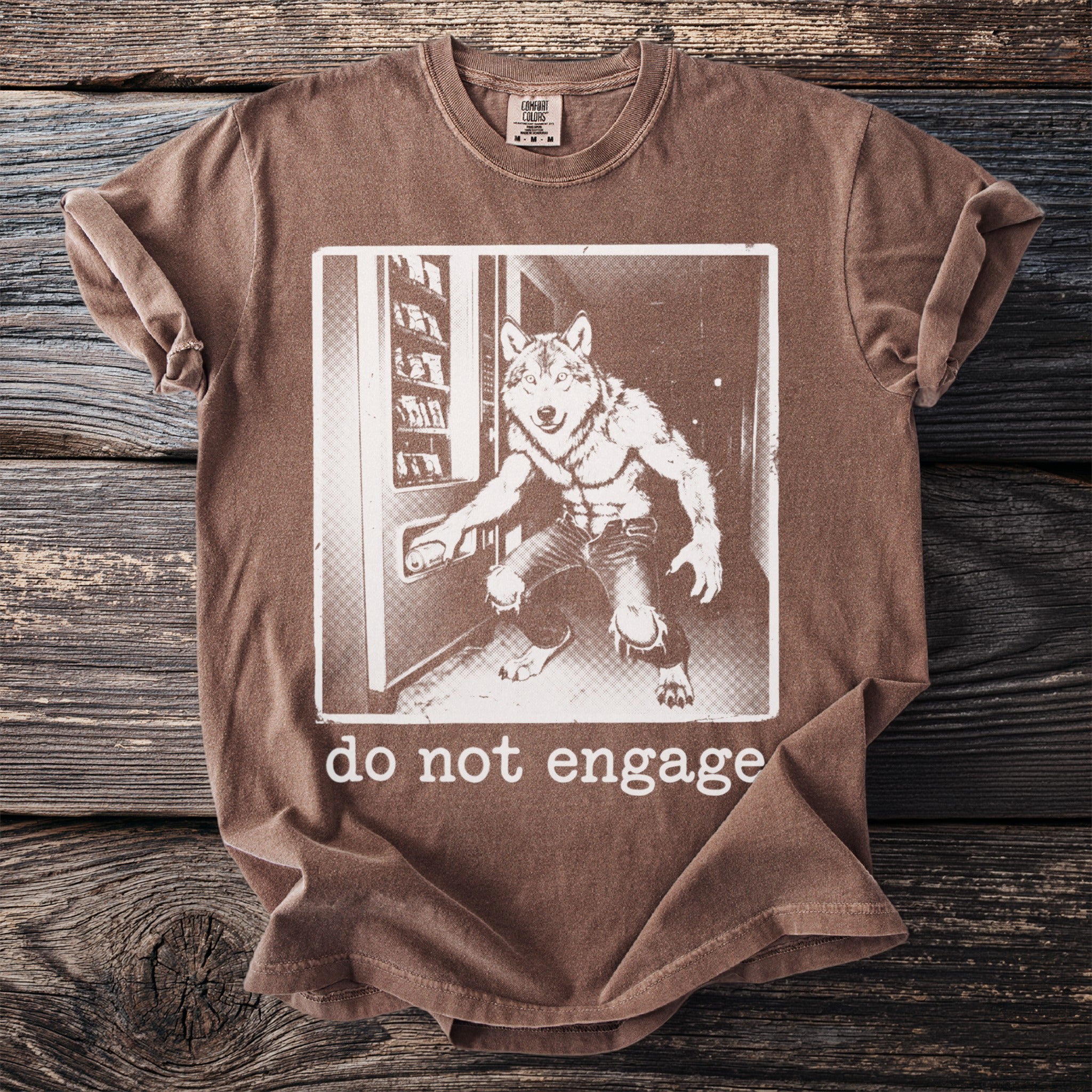 Brown t-shirt with a graphic of a werewolf at a vending machine and "do not engage" text.