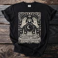 Black t-shirt with a mystical design featuring a crystal ball, hands, and mystical symbols.