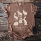 Brown t-shirt with "The Burrow Cabinet" and illustrations of six rabbit breeds.
