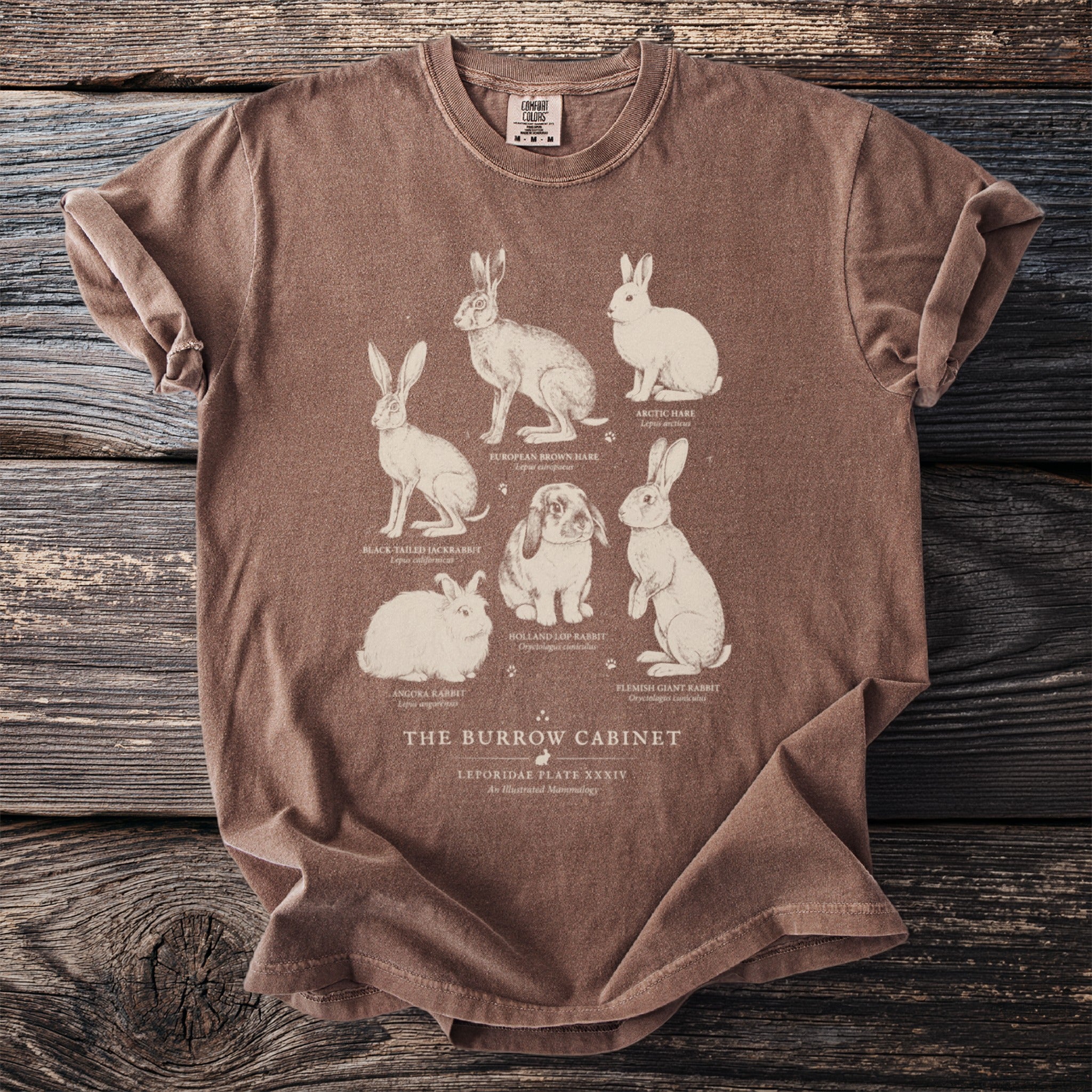Brown t-shirt with "The Burrow Cabinet" and illustrations of six rabbit breeds.