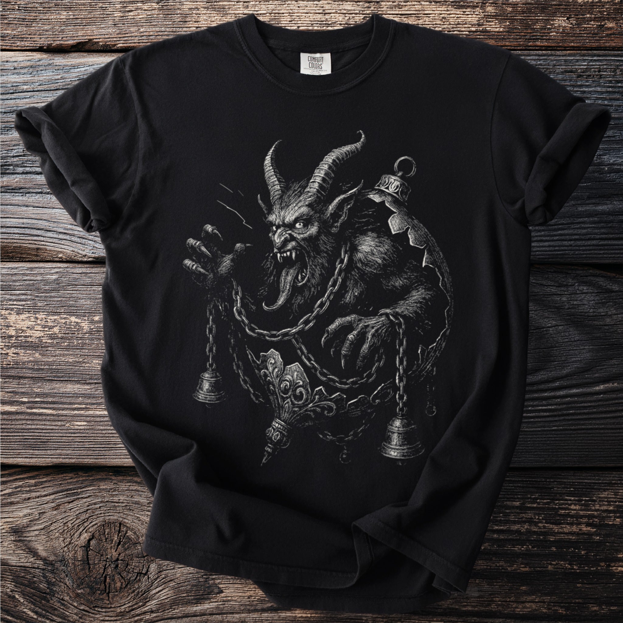 Black t-shirt with a detailed sketch of a horned creature and chains.
