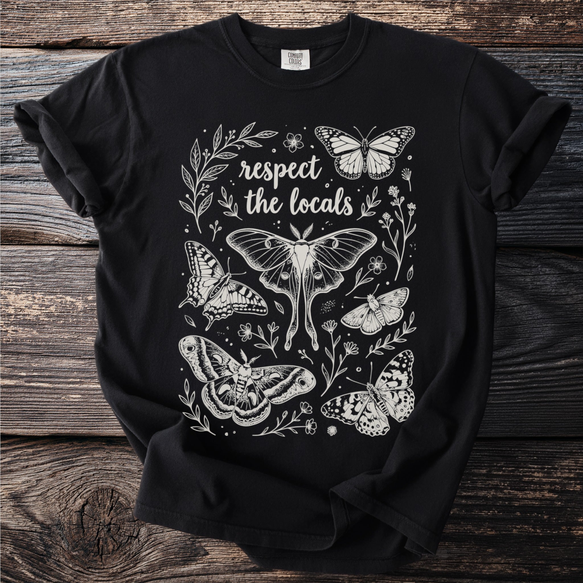 Black t-shirt with white moth and butterfly graphic and text "respect the locals".