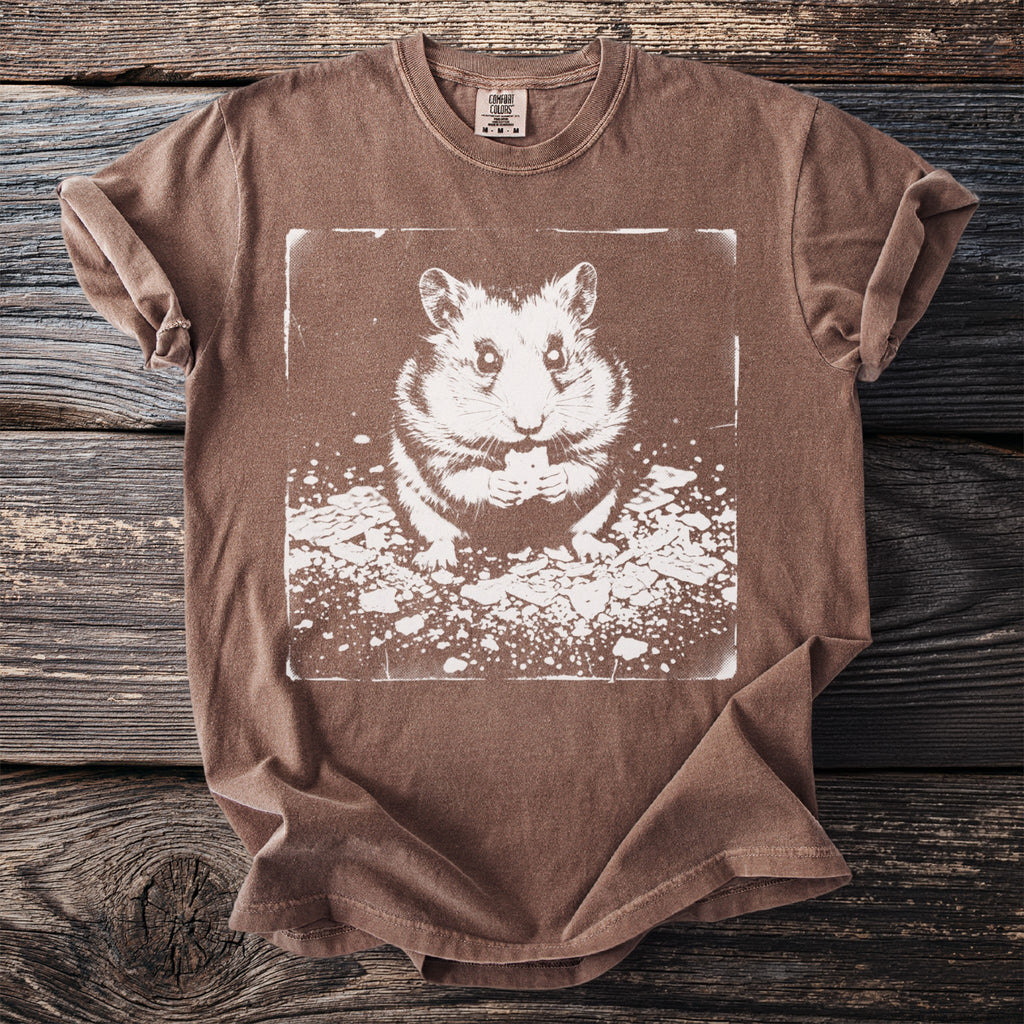 Brown t-shirt with a white graphic of a hamster eating a small treat.