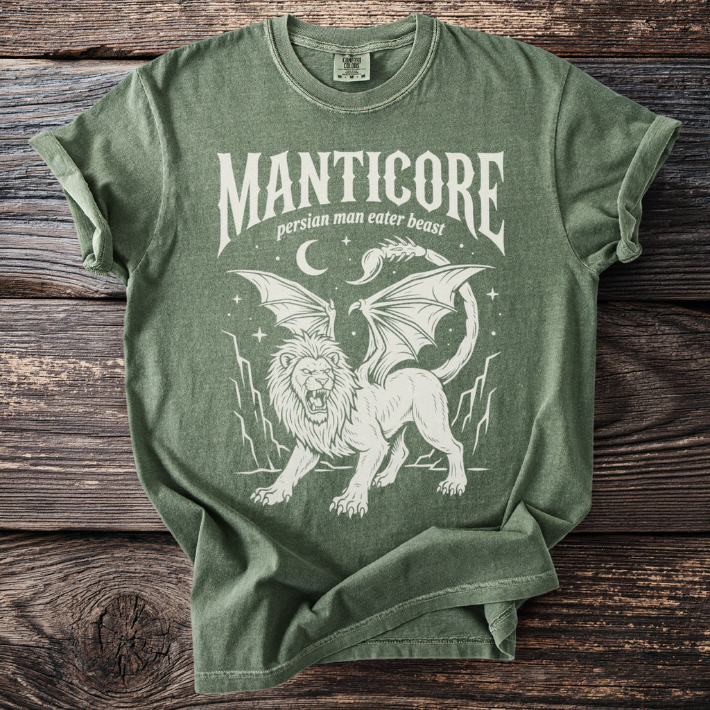 Green t-shirt with white "Manticore Persian Man Eater Beast" text and winged lion graphic.