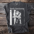 Dark grey t-shirt with "barely functioning" text and a wolf-man opening a door.