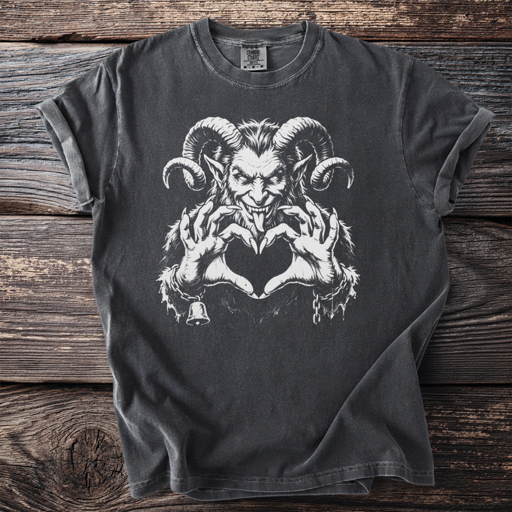 Dark grey t-shirt with white graphic of Krampus making a heart shape with his hands.