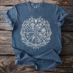 Blue t-shirt with a circular design featuring a deer skull, sun, plants, and a torch.