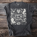 Dark grey t-shirt with white graphic of forest animals and "respect the locals" text.