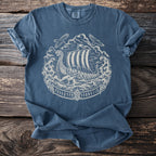 Blue t-shirt with a white print of a Viking ship, waves, dragons, eagles, and runes.