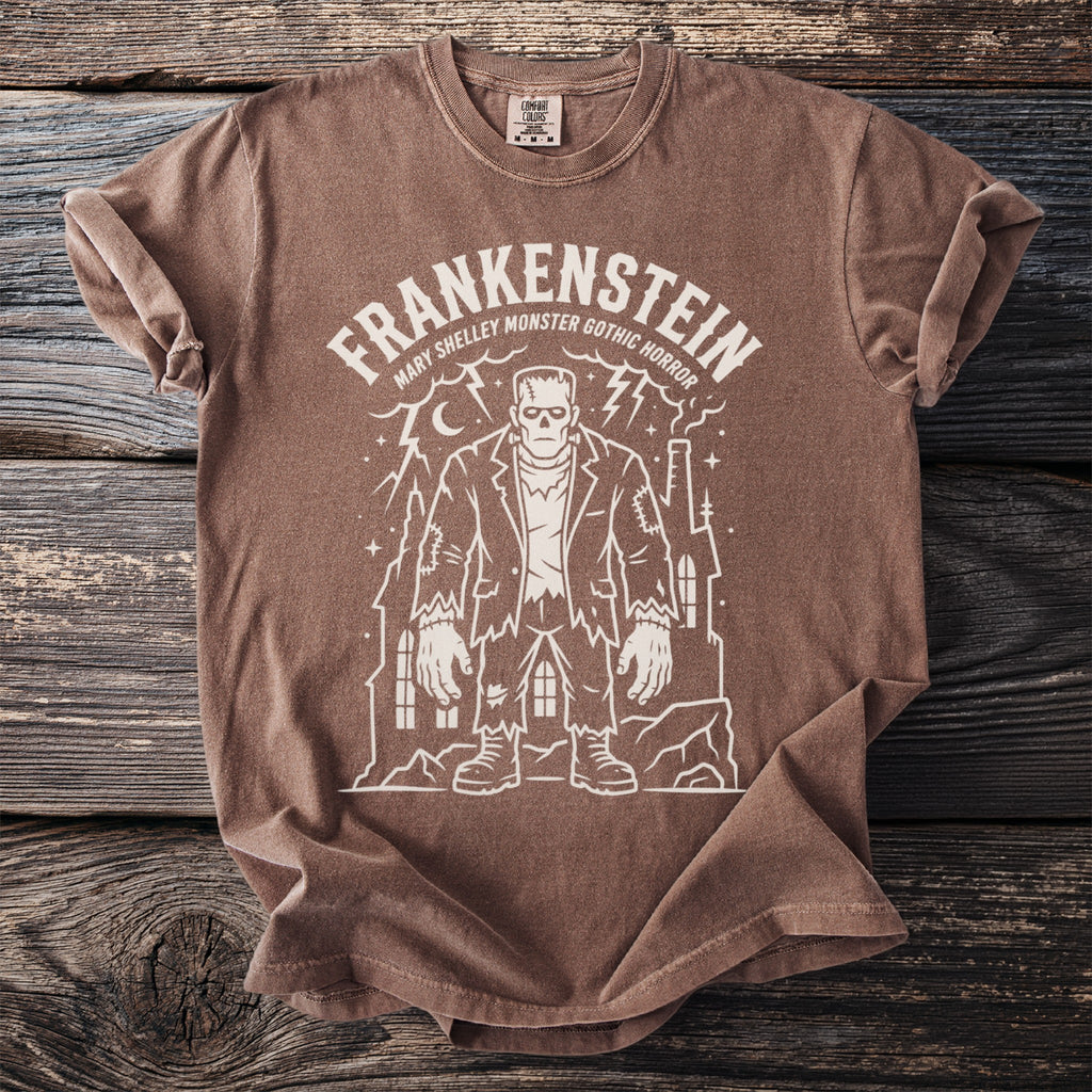 Brown t-shirt with a white Frankenstein monster graphic and text.