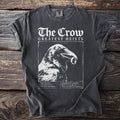 Dark grey t-shirt with "The Crow Greatest Heists" and a crow holding a ring.
