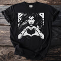 Black t-shirt with a graphic of a woman with raven and feathers forming a heart.