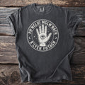 Dark t-shirt with circular graphic featuring an eye in a hand and text.