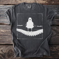 Gray t-shirt with white graphic of a seagull standing on an octopus tentacle.