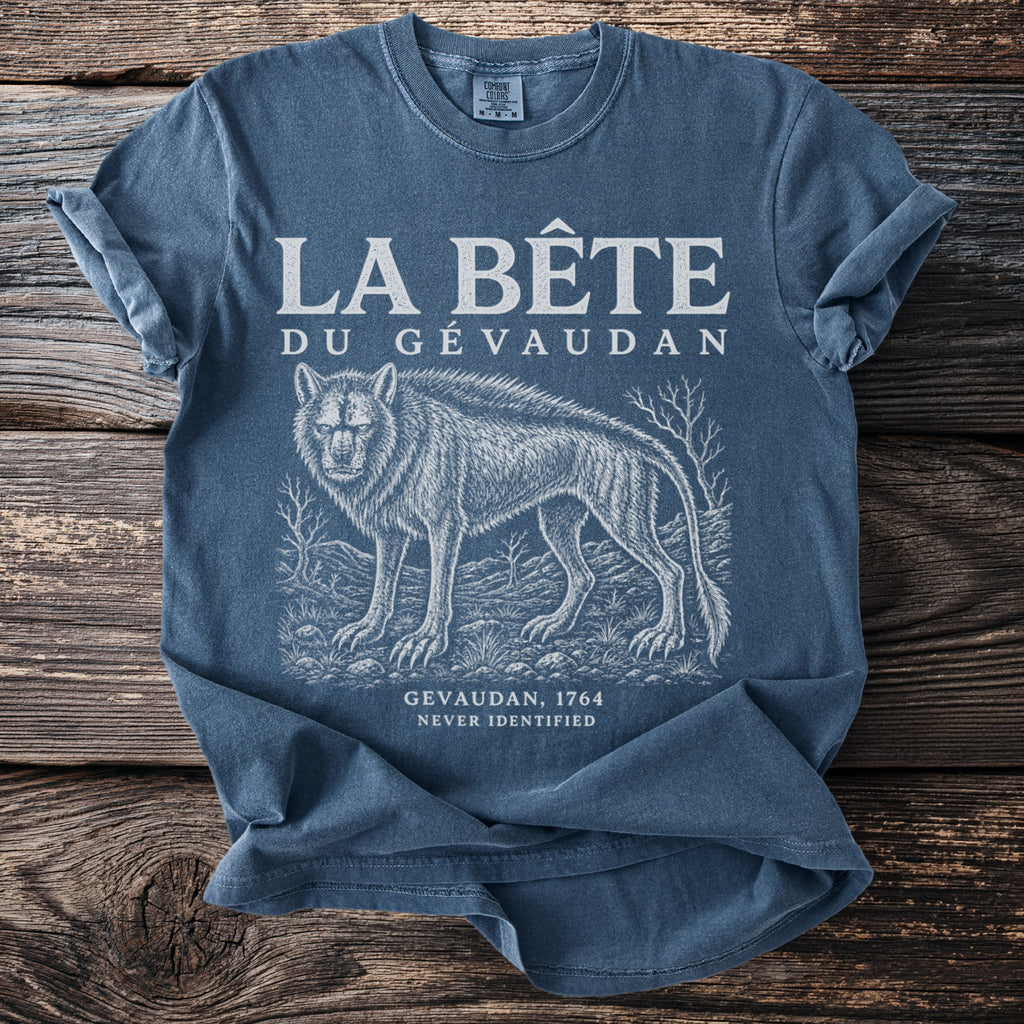 Blue t-shirt with "LA BÊTE DU GÉVAUDAN" and a wolf illustration.