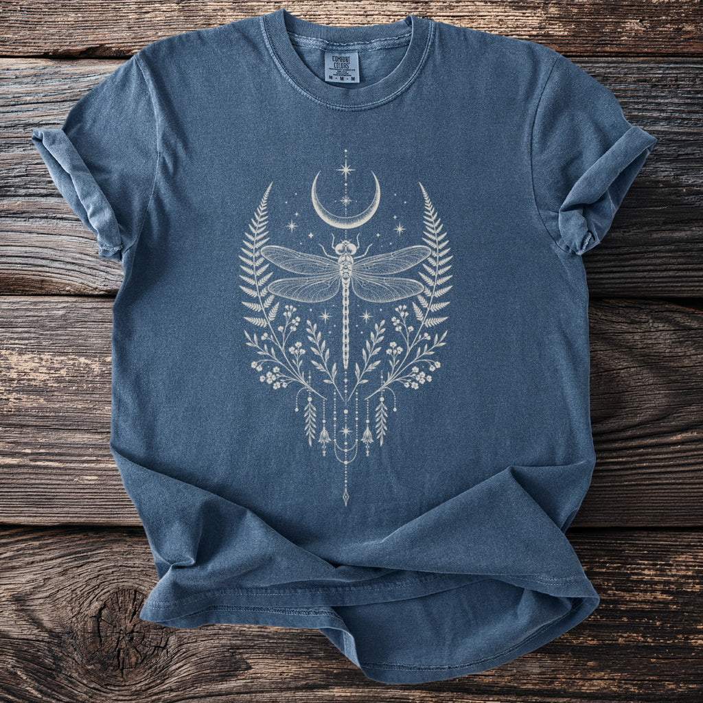 Blue t-shirt with a white dragonfly, crescent moon, and floral graphic.