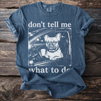 French bulldog in a car with coffee, text "don't tell me what to do".