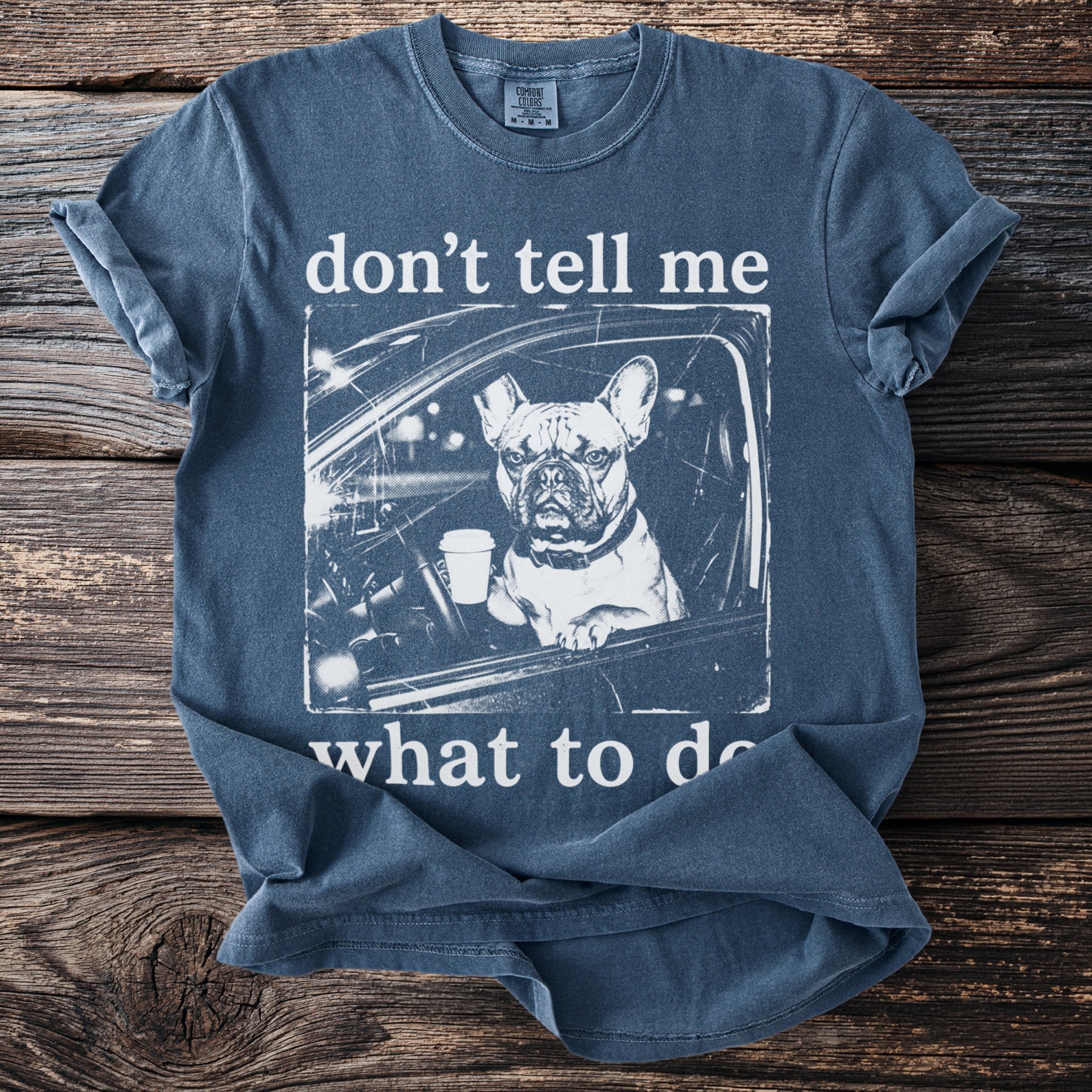 French bulldog in a car with coffee, text "don't tell me what to do".