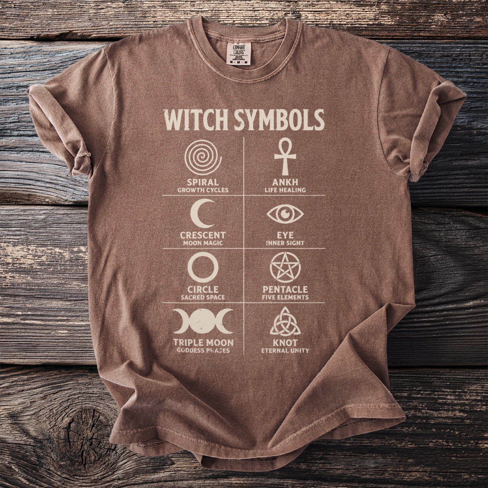 Brown t-shirt with "WITCH SYMBOLS" and grid of symbols with descriptions.