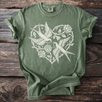 Green t-shirt with white print of two swallows and roses in a heart shape.