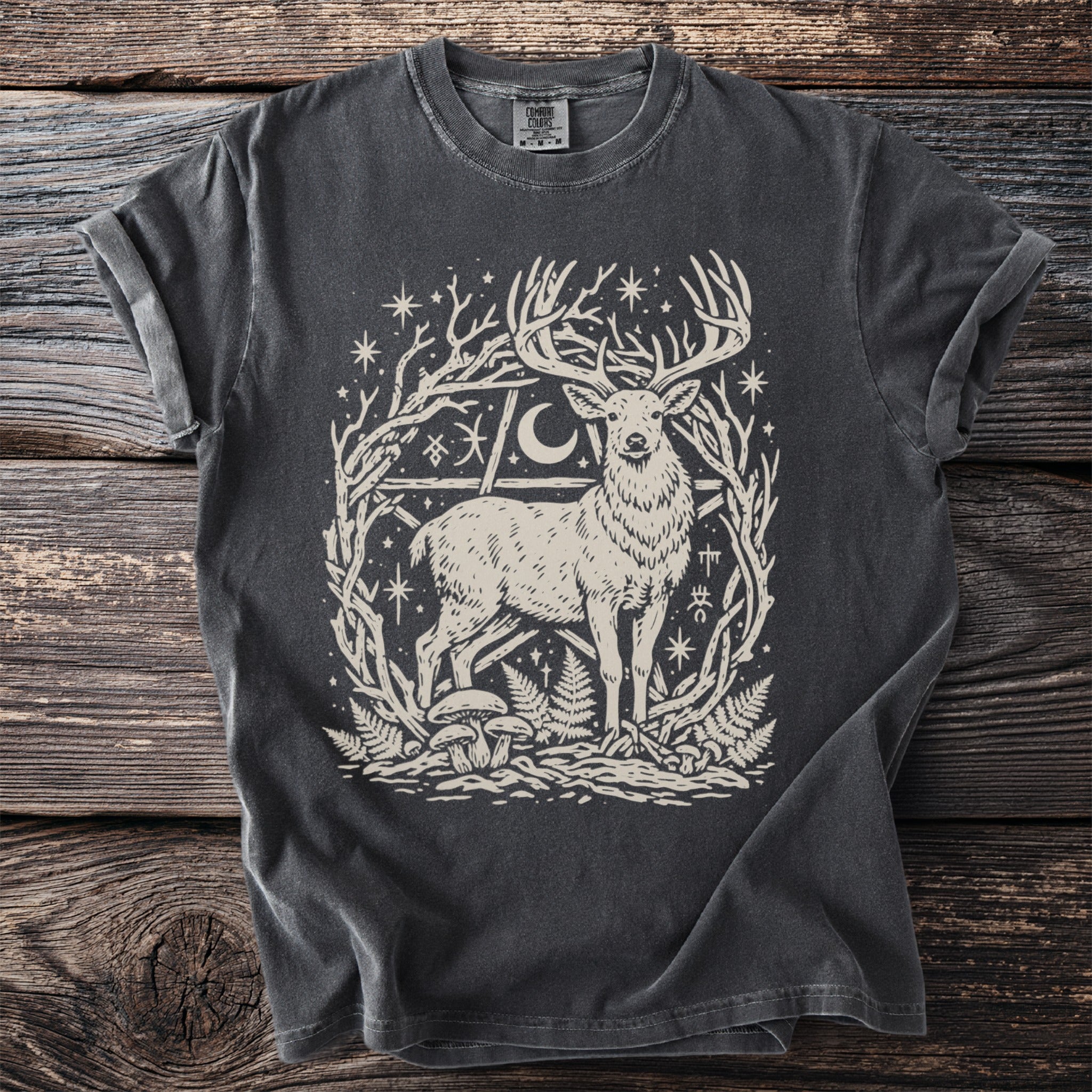 Dark gray t-shirt featuring a stag within a moon and star-filled pentagram frame.
