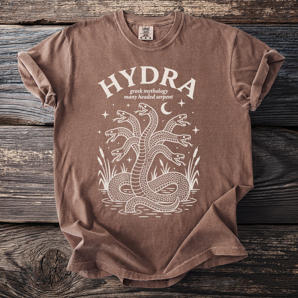 Brown t-shirt with white graphic of a five-headed hydra serpent and text HYDRA.