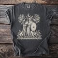 Valkyrie with spear and shield, ravens, moon, and trees on a dark t-shirt.