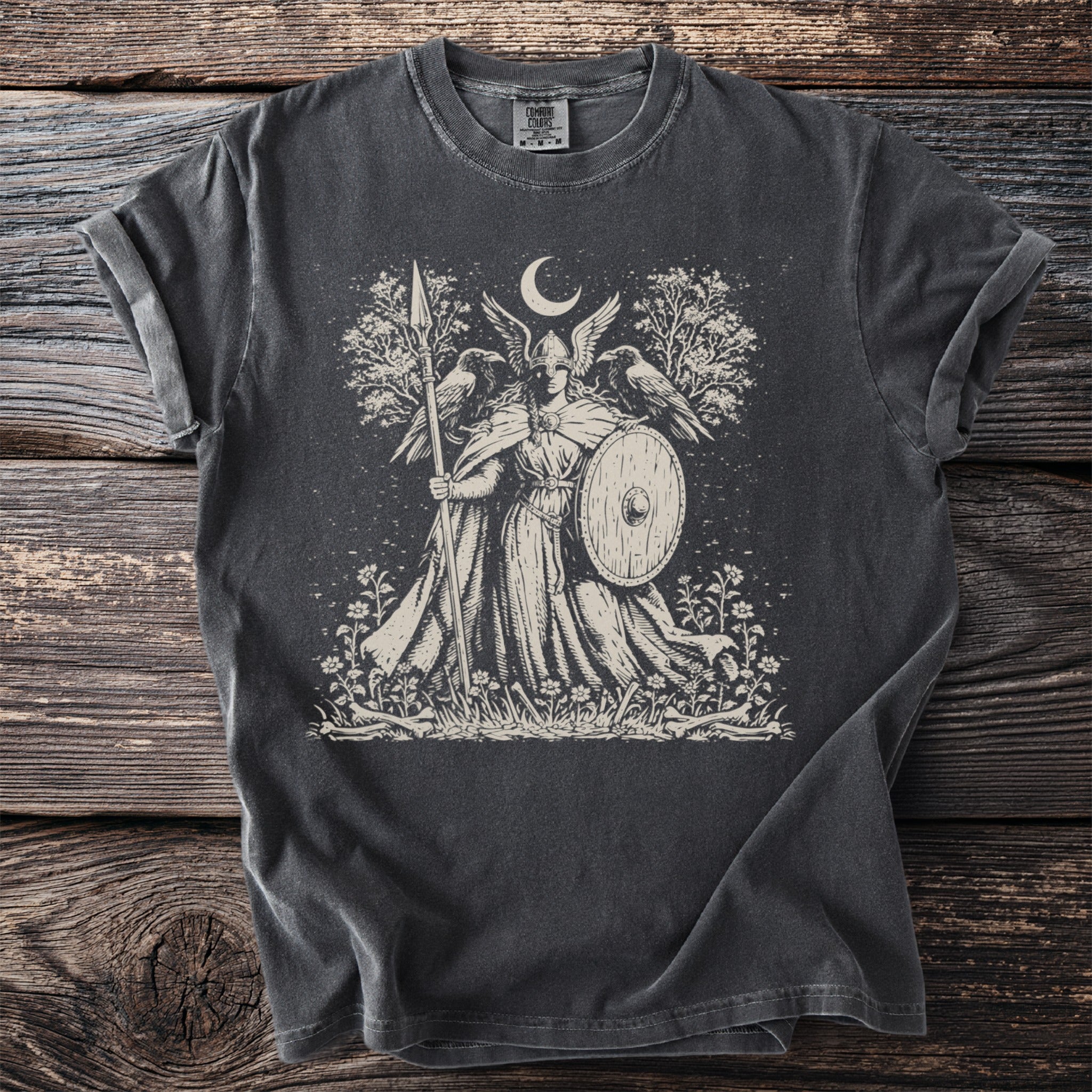 Valkyrie with spear and shield, ravens, moon, and trees on a dark t-shirt.