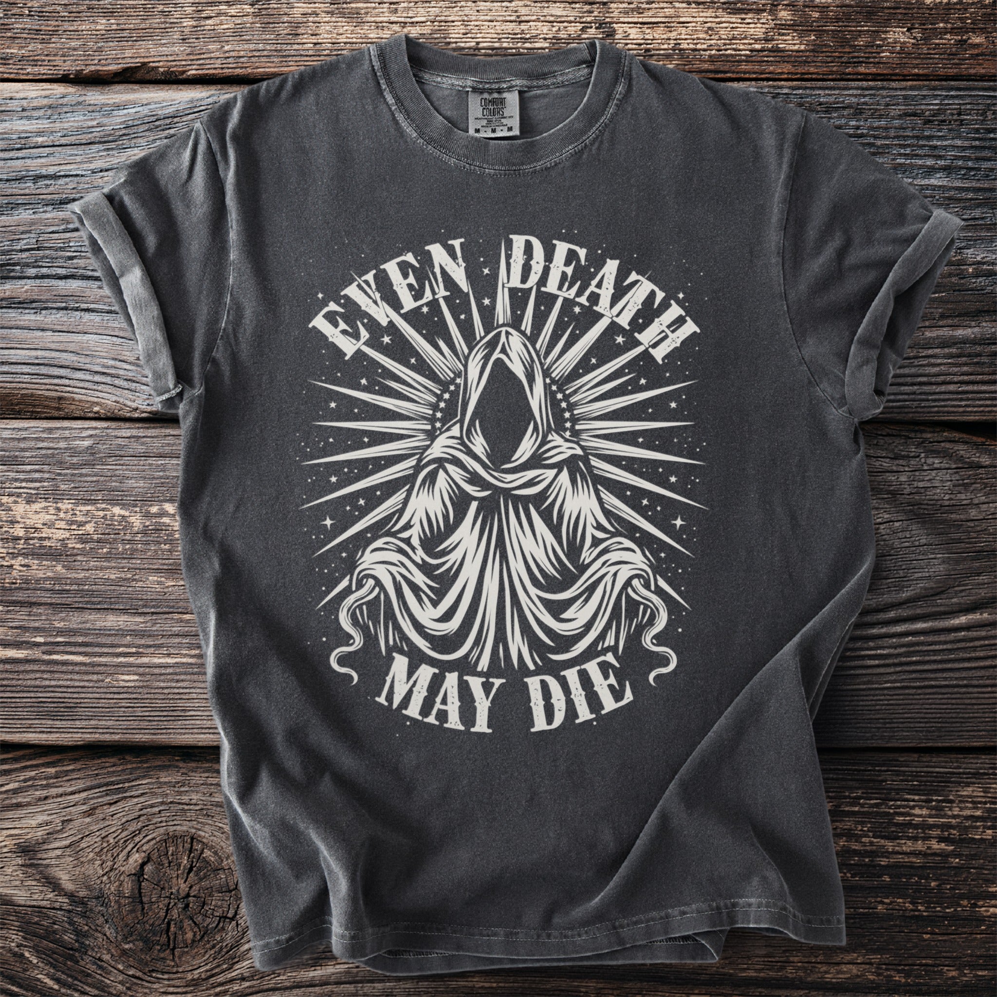 Dark gray t-shirt with a hooded figure and the text "EVEN DEATH MAY DIE".