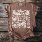 Brown t-shirt with white graphic of "respect the locals" and various sea creatures.