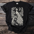 Black t-shirt with cream phoenix, crescent moon, stars, and apple tree design.
