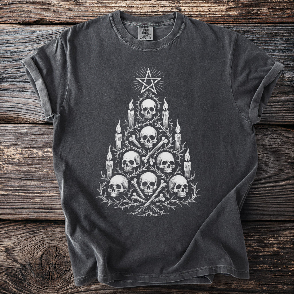 Dark t-shirt with a white graphic of a skull and bone Christmas tree topped with a pentagram.