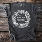Dark grey t-shirt with "Love the Unloved Specimens of Curiosity" and illustrations of obscure animals.