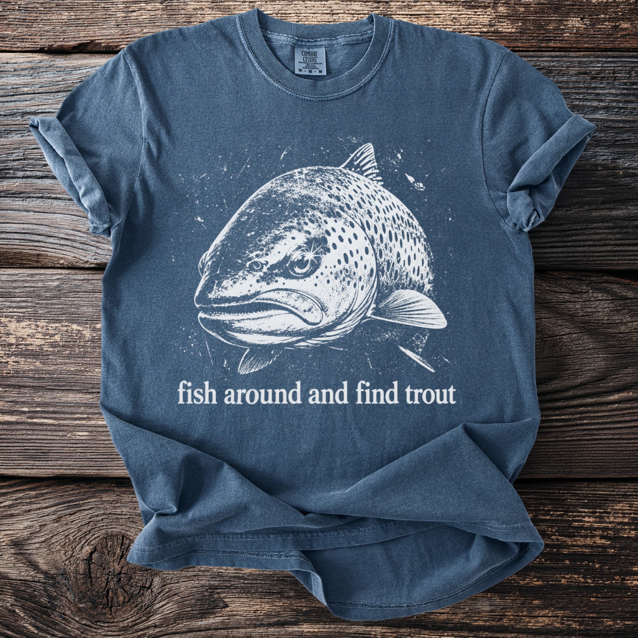 T-shirt with a white graphic of a trout and text "fish around and find trout".