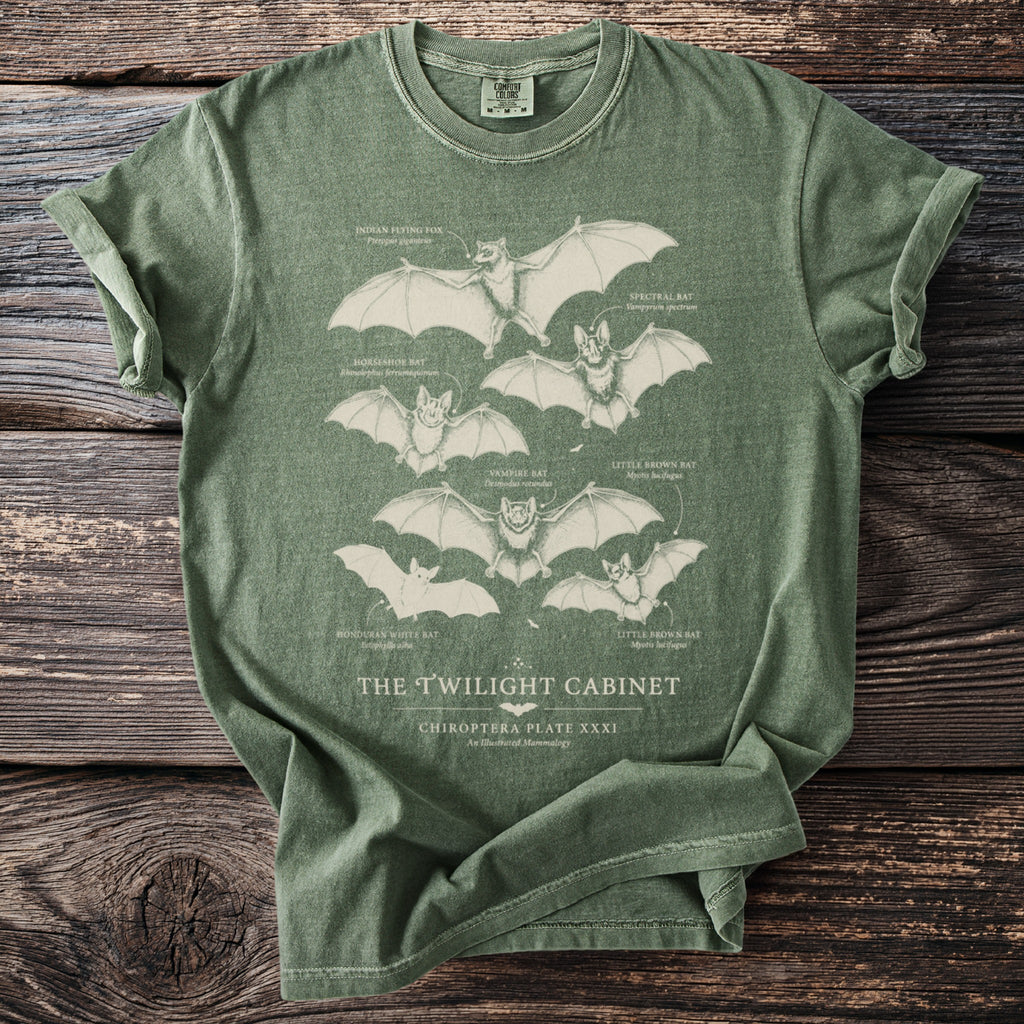 Green t-shirt with illustrations of bats and their names, titled "The Twilight Cabinet".
