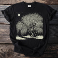 Black t-shirt with a linocut style print of a weeping willow tree under a moonlit starry sky.