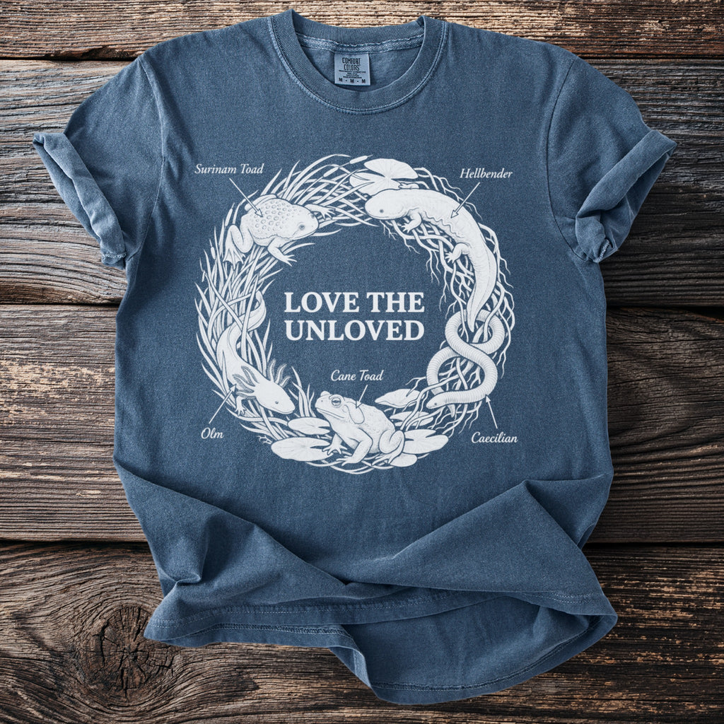 Blue t-shirt with "LOVE THE UNLOVED" and illustrations of unusual amphibians.
