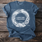 Blue t-shirt with "LOVE THE UNLOVED" and illustrations of unusual amphibians.