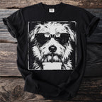 Black t-shirt with a grunge style illustration of a dog wearing sunglasses and drinking from a cup.