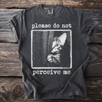 Dark grey t-shirt with distressed graphic of peeking cat and text "please do not perceive me".