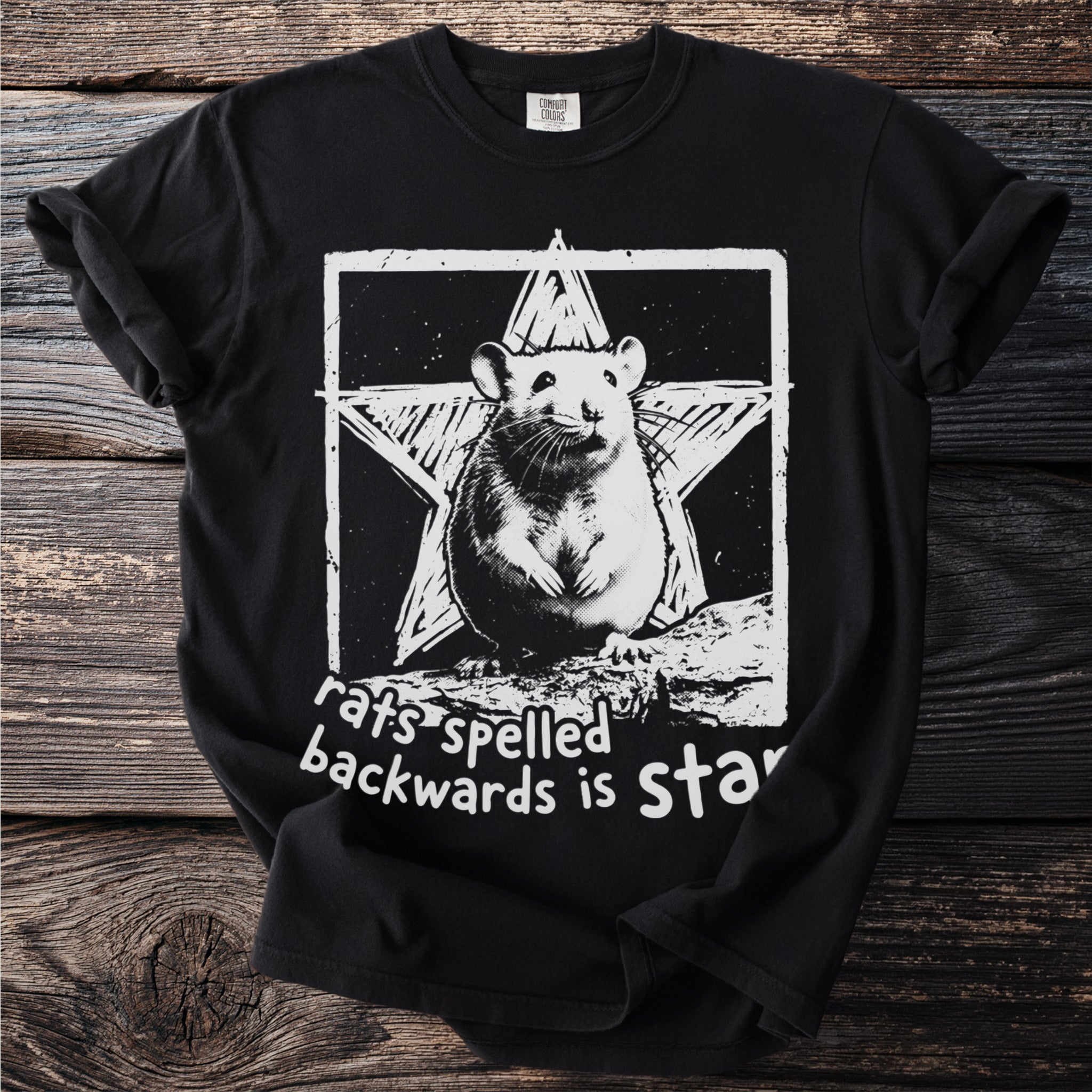 Black t-shirt with a white graphic of a rat in front of a star, text says "rats spelled backwards is star".