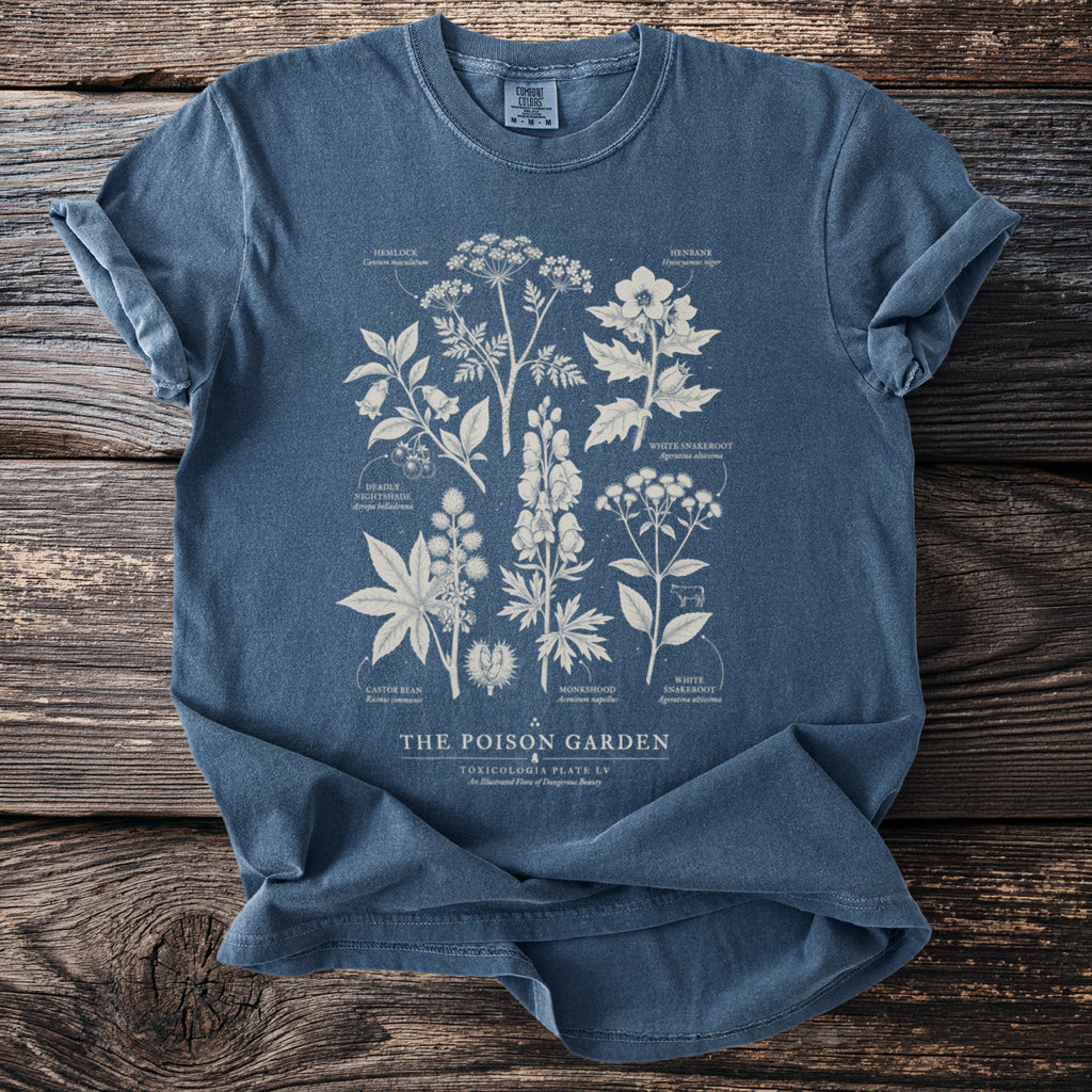 Vintage style blue t-shirt with poisonous plants illustration and text 'The Poison Garden'.