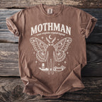 Brown t-shirt with Mothman, wings, West Virginia cryptid legend text, and bridges.