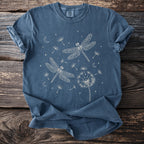 Blue t-shirt with graphic of two dragonflies, dandelions, moons, and stars.