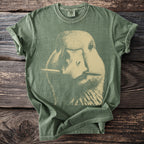 Green t-shirt with a vintage style duck graphic holding a pencil in its beak.