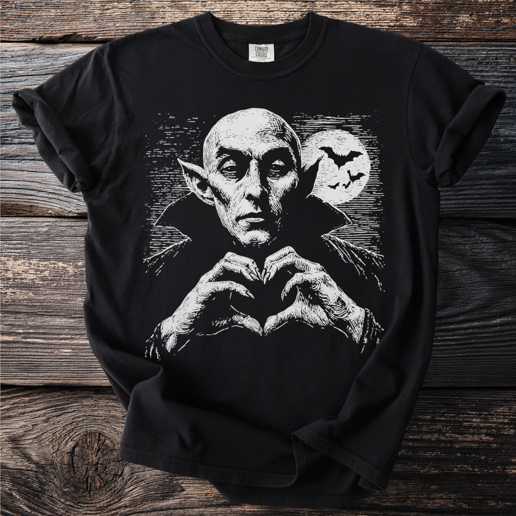 Black t-shirt featuring a white line art graphic of Dracula making a heart shape with his hands.