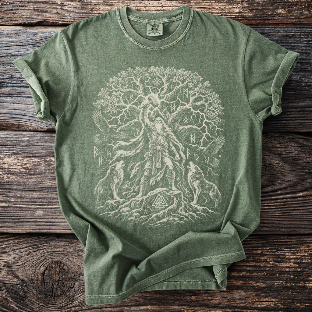 Green t-shirt with Norse Yggdrasil tree, Odin, wolves, and runes design.