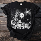 Black t-shirt with a graphic of an opossum, mouse, raccoon, frog, snake, spider, snail, and moth with text "love the unloved".