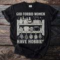 Black t-shirt with text "God forbid women have hobbies" and witchy illustrations.